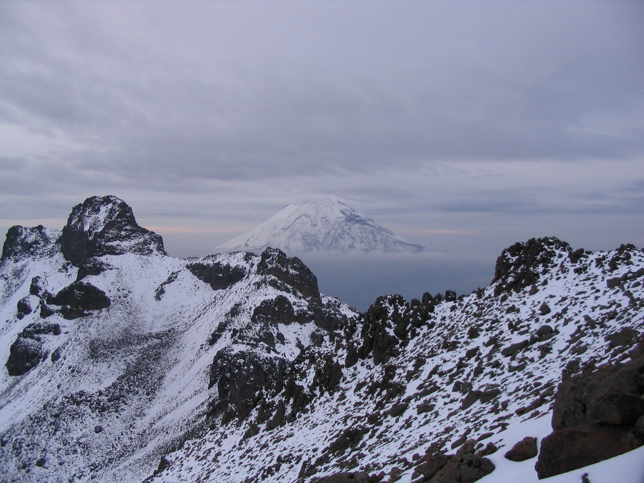 I snapped this when climbing Iztaccihuatl circa 2004. It’s looking back at Popo over some of Iztac’s spine.